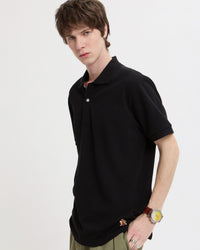 baracuta black polo shirt worn front view on model