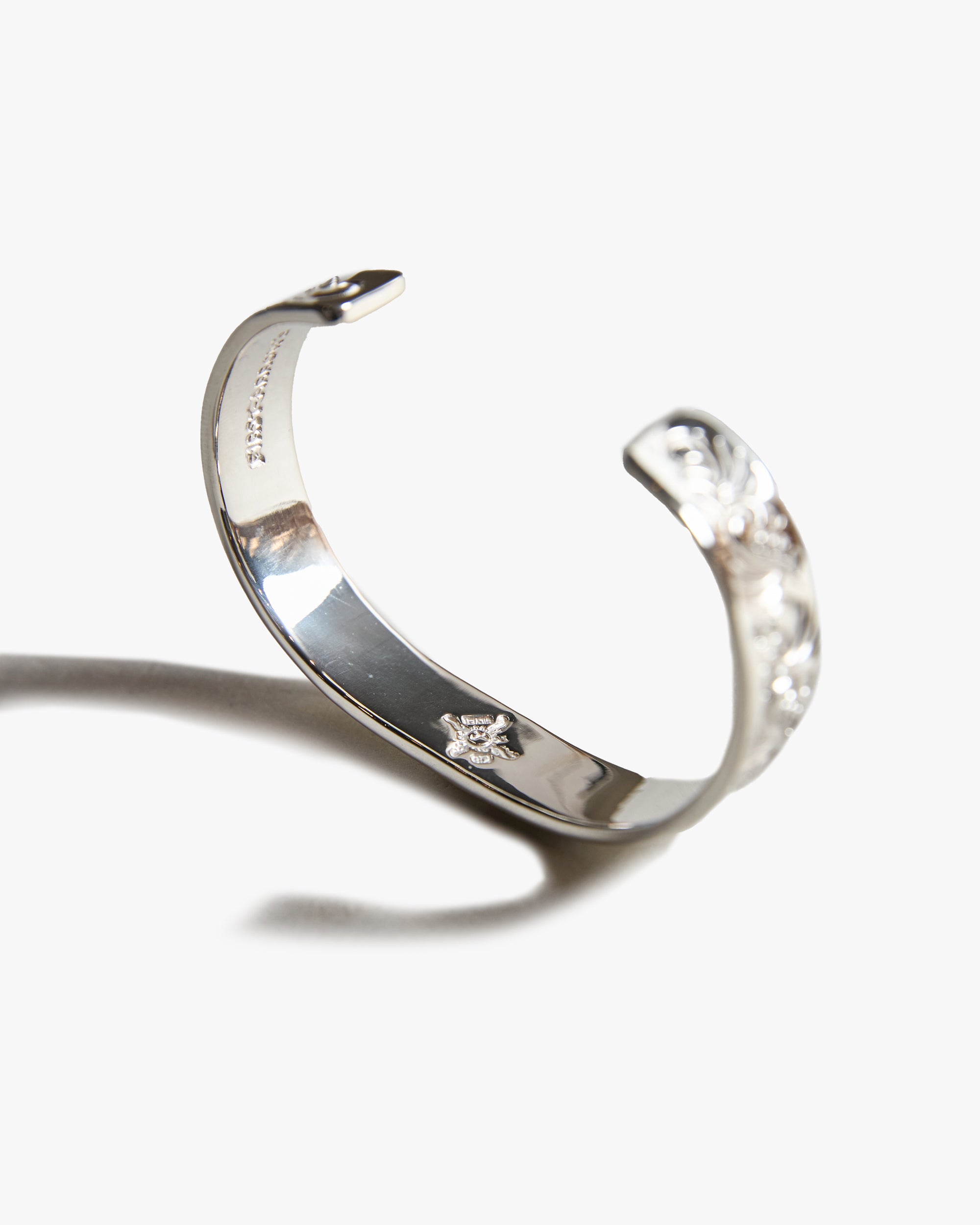 First Arrows BR-026 Silver 12mm Flat Hammered Arabesque Carved Bangle