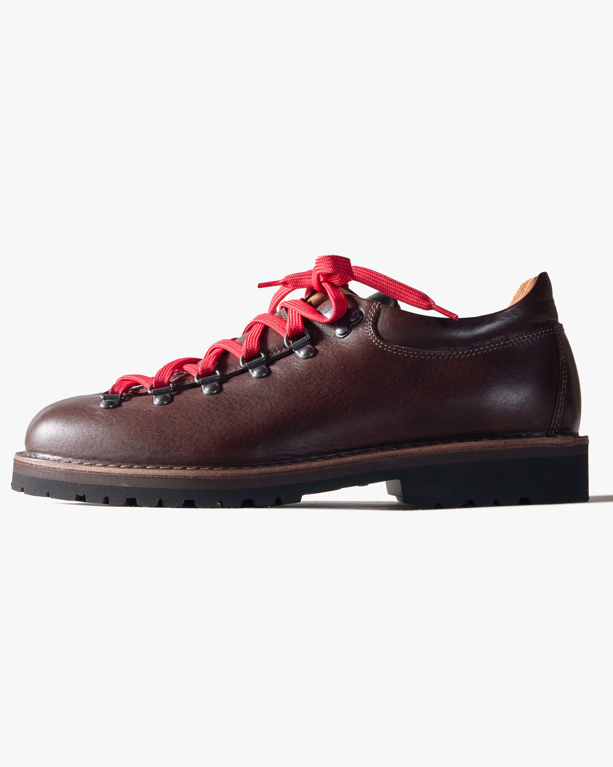 Dark Brown Fracap leather shoe with red laces on a white background