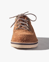 Brown cork Fracap shoe with white laces on a light gray background