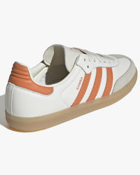 adidas womens samba og trainers white and orange with gum sole at an angle