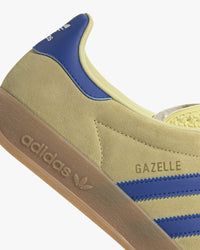 adidas gazelle indoor trainers yellow suede upper with blue stripes at an angle
