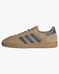 adidas handball spezial trainers sandstone with navy stripes from side against white background