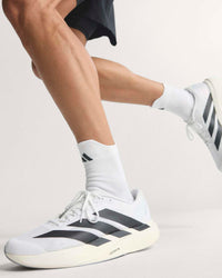 adidas adizero evo sl lightweight trainers in action running shot, styled by model