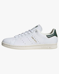 adidas stan smith trainers white with green heel tab from side against white background