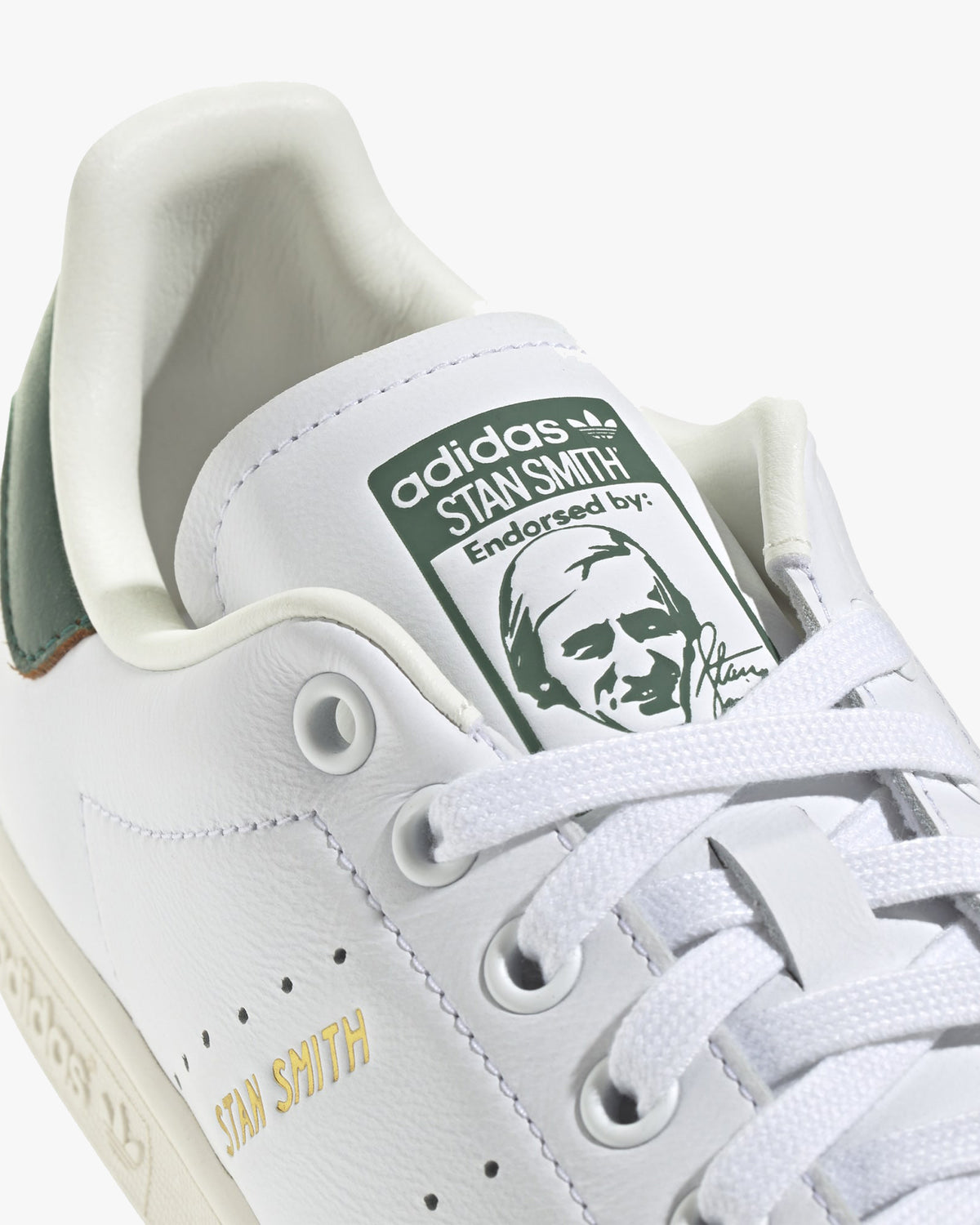 adidas stan smith trainers green heel tab and lace detail close up