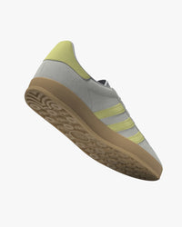 adidas gazelle indoor trainers grey suede with yellow stripes and gum sole at an angle