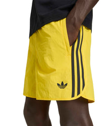 adidas sprinter shorts yellow close up showing fabric and logo detail