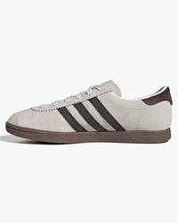 adidas stadt trainers white leather upper with brown stripes at an angle