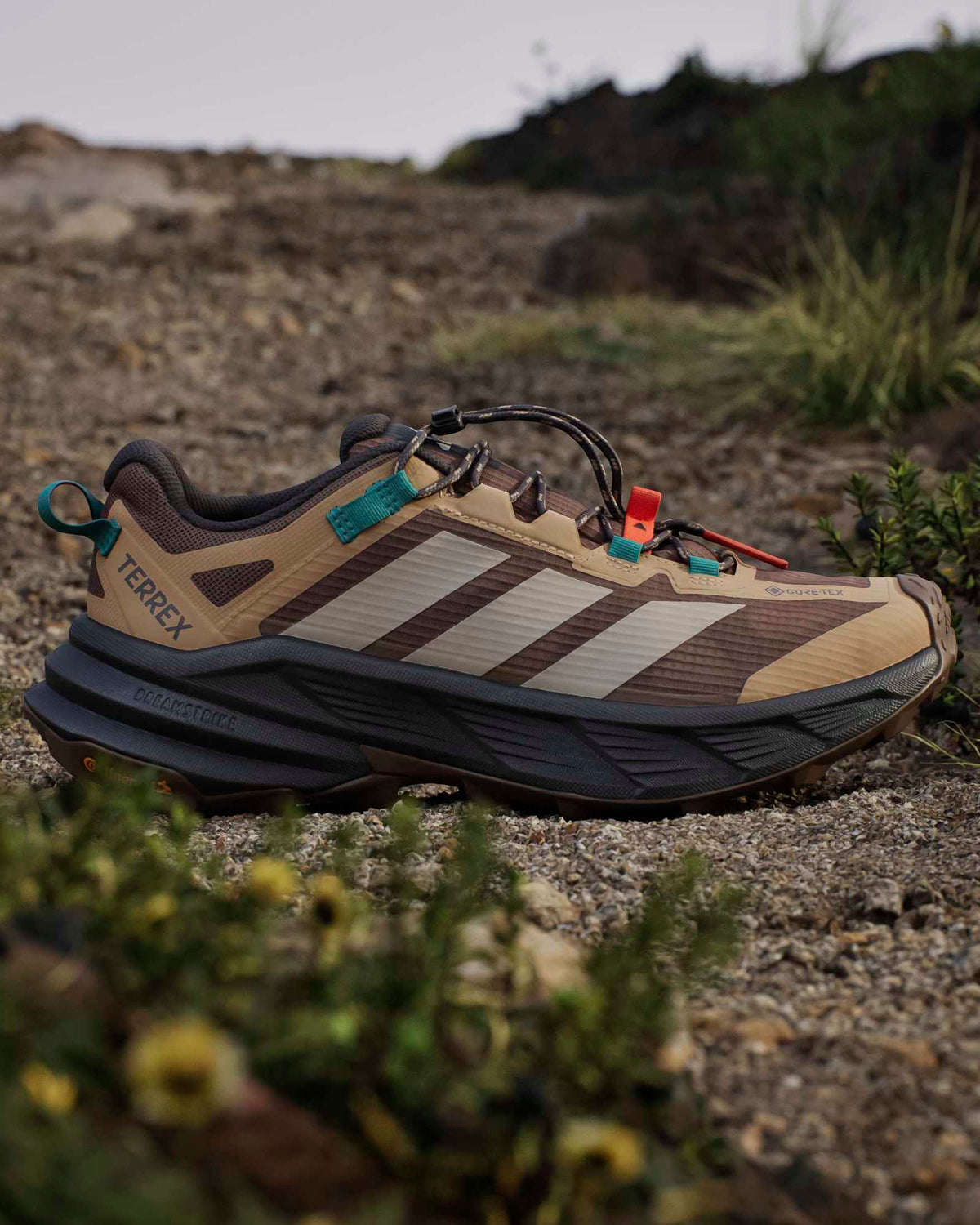 adidas terrex freehiker hiking shoes beige and teal on trail showing outsole gri